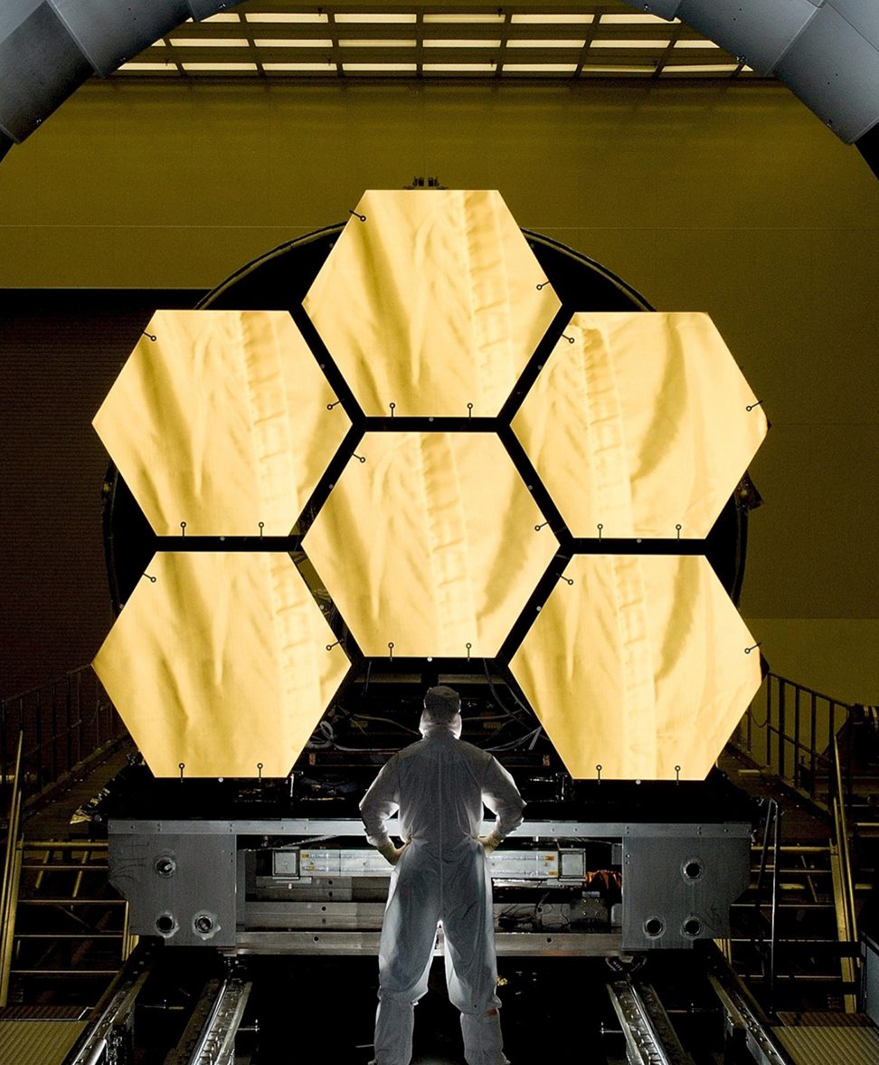 Guy standing in front of hexagons